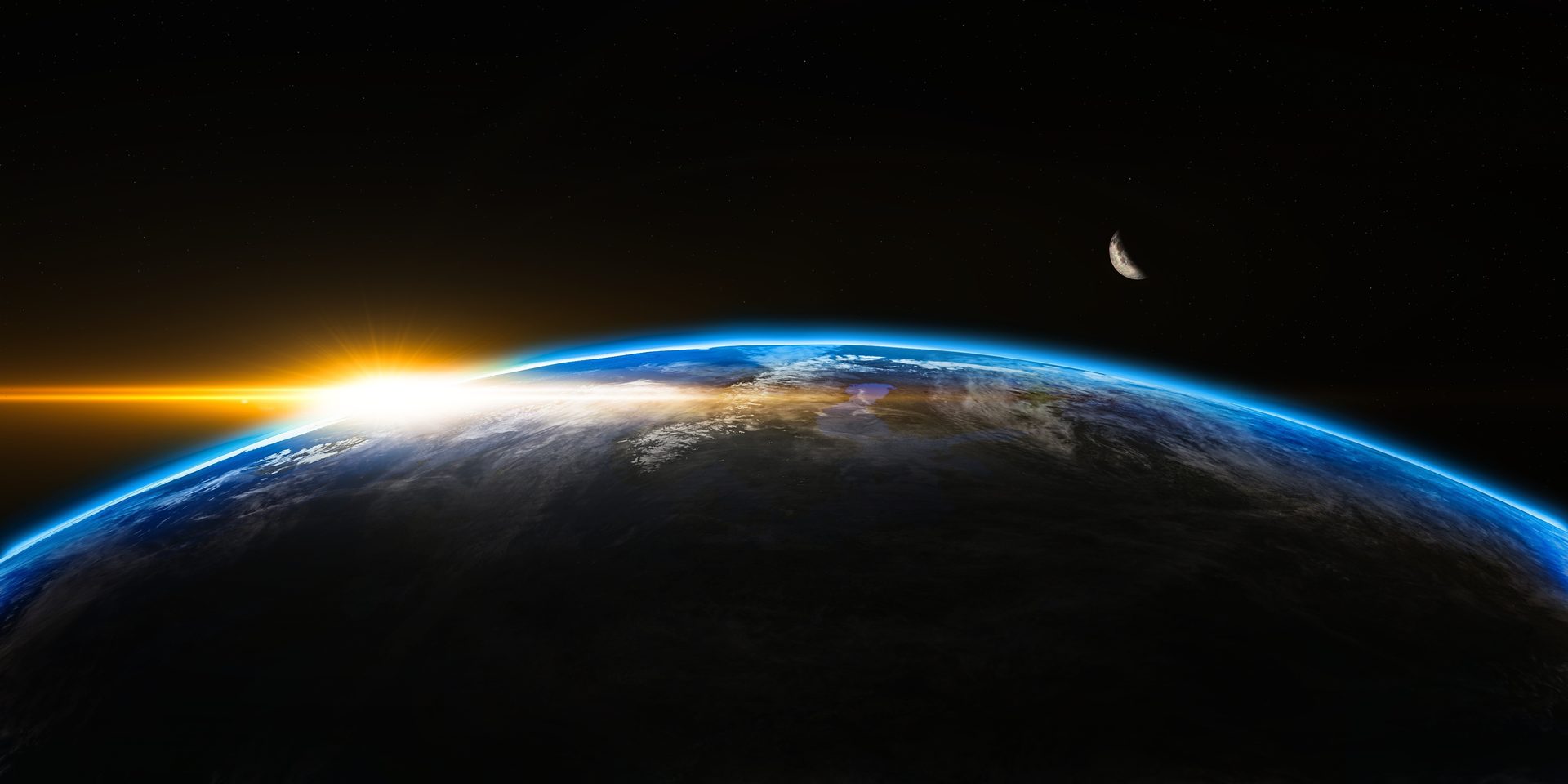 Die Erde bei Sonnenaufgang aus dem Weltall, Sinnbild für Nachhaltigkeit als unternehmerische Aufgabe